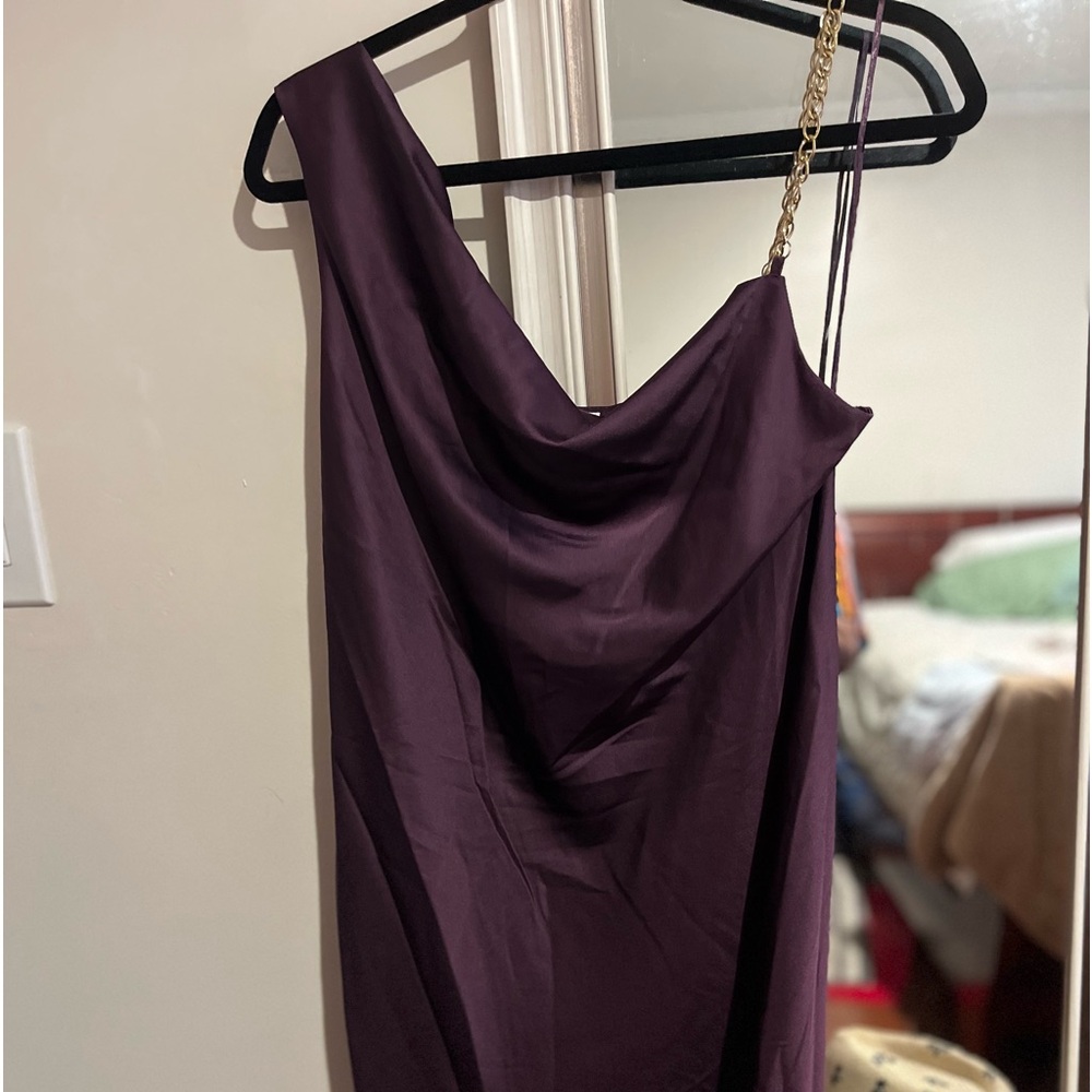 Eggplant color med.  Flattering dress